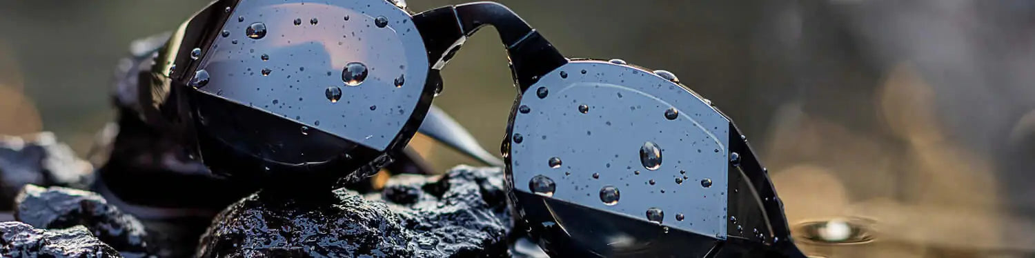 themagic5 swimming goggles on rocks at the beach